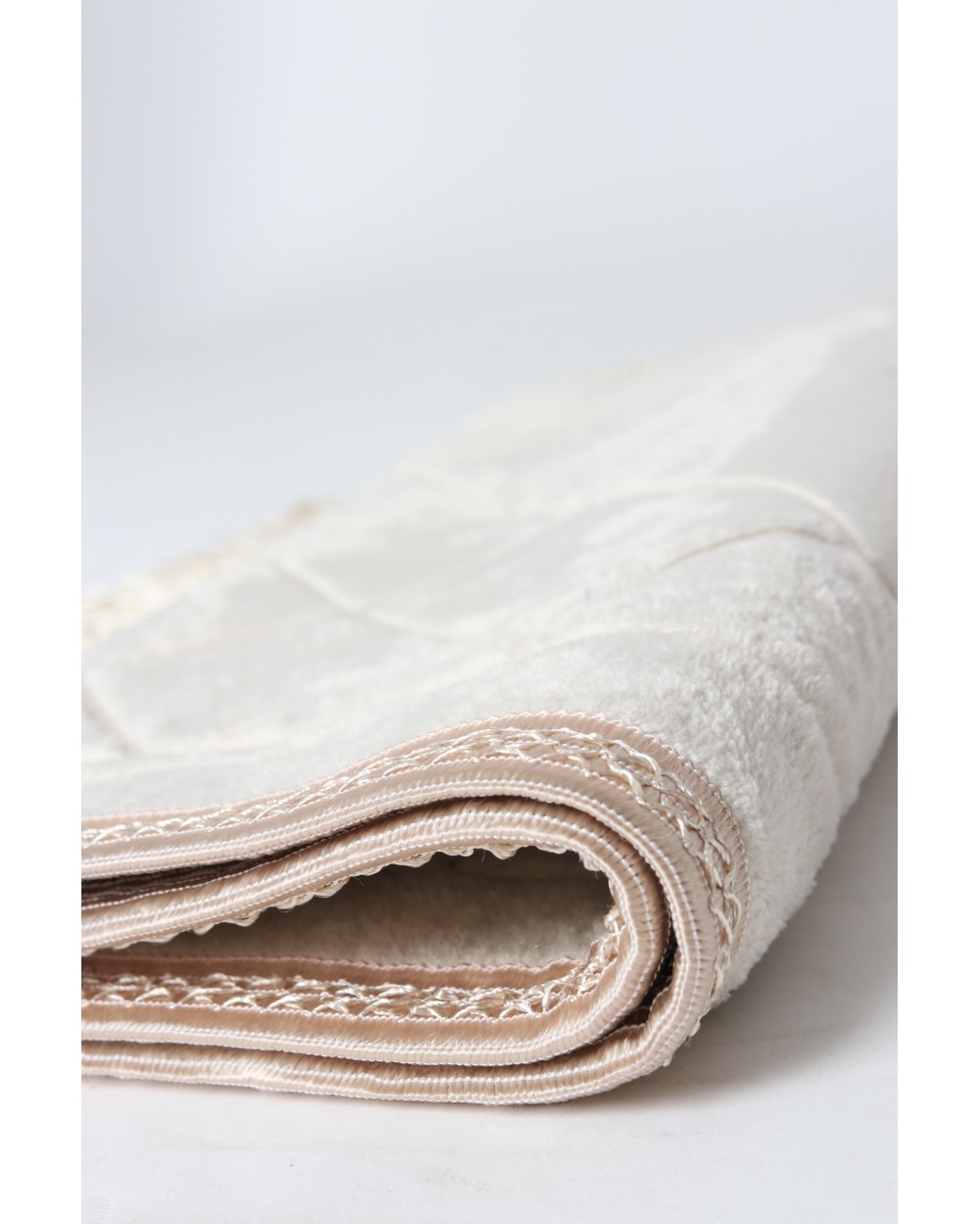 Small padded prayer rug